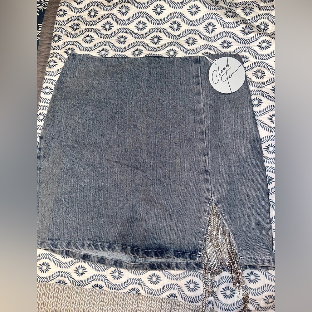 Jean mini skirt with small slit covered in jewels